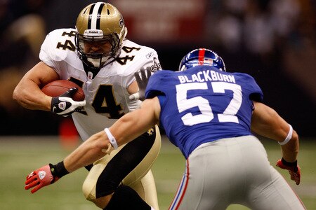 NEW ORLEANS - OCTOBER 18:  Heath Evans #44 of the New Orleans Saints is tackled by Chase Blackburn #57 of the New York Giants at the Louisiana Superdome on October 18, 2009 in New Orleans, Louisiana.  <br /><br /><span class="help">(Photo by Chris Graythen/Getty Images)</span>