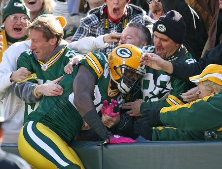 GREEN BAY, WI - OCTOBER 18: James Jones #89 of the Green Bay Packers leaps into the stands after scoring a touchdown against the Detroit Lions at Lambeau Field on October 18, 2009 in Green Bay, Wisconsin. <br /><br /><span class="help">(Photo by Jonathan Daniel/Getty Images)</span>