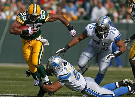 GREEN BAY, WI - OCTOBER 18: Ryan Grant #25 of the Green Bay Packers is tackled by the shoes by DeAndre Levy #54 of Detroit Lions as Turk McBride #75 trails the play at Lambeau Field on October 18, 2009 in Green Bay, Wisconsin. <br /><br /><span class="help">(Photo by Jonathan Daniel/Getty Images)</span>