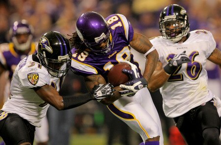 MINNEAPOLIS - OCTOBER 18:  Wide receiver Sidney Rice #18 of the Minnesota Vikings makes a first down reception and is tackled by Fabian Washington #31 of the Baltimore Ravens during NFL action at Hubert H. Humphrey Metrodome on October 18, 2009 in Minneapolis, Minnesota.  <br /><br /><span class="help">(Photo by Doug Pensinger/Getty Images)</span>
