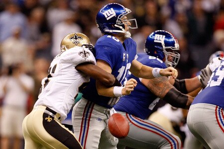 NEW ORLEANS - OCTOBER 18:  Jonathan Vilma #51 of the New Orleans Saints forces a fumble by quarterback Eli Manning #10 of the New York Giants at the Louisiana Superdome on October 18, 2009 in New Orleans, Louisiana.  <br /><br /><span class="help">(Photo by Chris Graythen/Getty Images)</span>