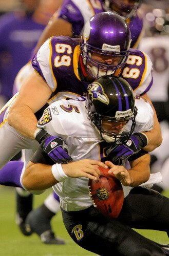 MINNEAPOLIS - OCTOBER 18:  Defensive end Jared Allen #69 of the Minnesota Vikings sacks quarterback Joe Flacco #5 of the Baltimore Ravens in the fourth quarter during NFL action at Hubert H. Humphrey Metrodome on October 18, 2009 in Minneapolis, Minnesota. The Vikings defeated the Ravens 33-31.  <br /><br /><span class="help">(Photo by Doug Pensinger/Getty Images)</span>