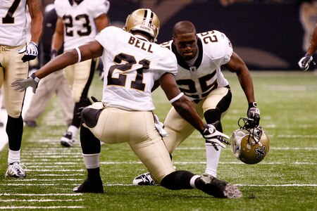 NEW ORLEANS - OCTOBER 18:  Mike Bell #21 and Reggie Bush #25 of the New Orleans Saints celebrate after Bell scored a touchdown against the New York Giants at the Louisiana Superdome on October 18, 2009 in New Orleans, Louisiana.  The Saints defeated the Giants 48-27.   <br /><br /><span class="help">(Photo by Chris Graythen/Getty Images)</span>