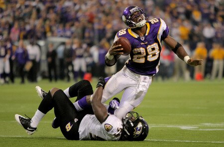 MINNEAPOLIS - OCTOBER 18:  Running back Adrian Peterson #28 of the Minnesota Vikings grimmaces as he is tackled by Dannell Ellerbe #59 of the Baltimore Ravens in the fourth quarter during NFL action at Hubert H. Humphrey Metrodome on October 18, 2009 in Minneapolis, Minnesota. The Vikings defeated the Ravens 33-31.  <br /><br /><span class="help">(Photo by Doug Pensinger/Getty Images)</span>