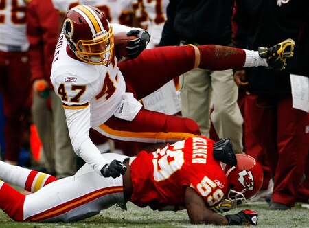 LANDOVER, MD - OCTOBER 18: Tight end Chris Cooley #47 of the Washington Redskins is tackled by Derrick Johnson #58 of the Kansas City Chiefs during their game October 18, 2009 at FedEx Field in Landover, Maryland. Kansas City kicker Ryan Succop had 4 field goals as the Chiefs won the game 14-6.  <br /><br /><span class="help">(Photo by Win McNamee/Getty Images)</span>