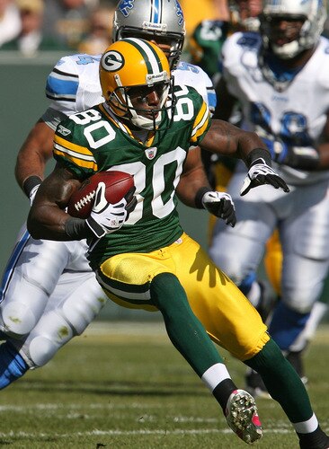 GREEN BAY, WI - OCTOBER 18: Donald Driver #80 of the Green Bay Packers run against the Detroit Lions after catching a pass at Lambeau Field on October 18, 2009 in Green Bay, Wisconsin. The Packers defeated the Lions 26-0. <br /><br /><span class="help">(Photo by Jonathan Daniel/Getty Images)</span>