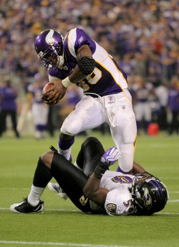 MINNEAPOLIS - OCTOBER 18:  Running back Adrian Peterson #28 of the Minnesota Vikings rushes and is tackled by Dannell Ellerbe #59 of the Baltimore Ravens during NFL action at Hubert H. Humphrey Metrodome on October 18, 2009 in Minneapolis, Minnesota. The Vikings defeated the Ravens 33-31.  <br /><br /><span class="help">(Photo by Doug Pensinger/Getty Images)</span>