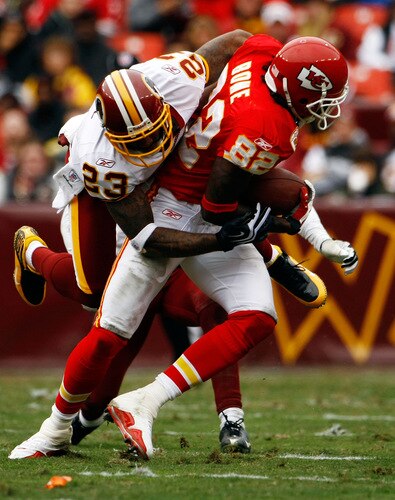 LANDOVER, MD - OCTOBER 18:  Cornerback DeAngelo Hall #23 of the Washington Redskins tackles wide receiver Dwayne Bowe #82 of the Kansas City Chiefs during their game October 18, 2009 at FedEx Field in Landover, Maryland.  <br /><br /><span class="help">(Photo by Win McNamee/Getty Images)</span>