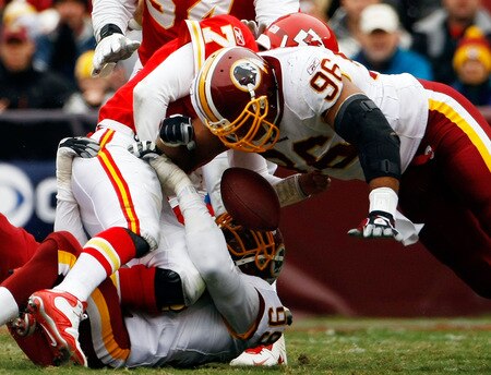 LANDOVER, MD - OCTOBER 18: Cornelius Griffin #96 of the Washington Redskins forces a fumble while sacking Matt Cassel #7 of the Kansas City Chiefs during their game October 18, 2009 at FedEx Field in Landover, Maryland. Kansas City kicker Ryan Succop had 4 field goals as the Chiefs won the game 14-6.  <br /><br /><span class="help">(Photo by Win McNamee/Getty Images)</span>