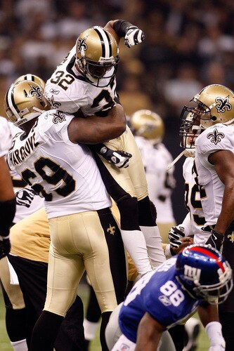 NEW ORLEANS - OCTOBER 18:  Jabari Greer #32 celebrates with Anthony Hargrove #69 of the New Orleans Saints after making an interception against the New York Giants at the Louisiana Superdome on October 18, 2009 in New Orleans, Louisiana.  The Saints defeated the Giants 48-27.   <br /><br /><span class="help">(Photo by Chris Graythen/Getty Images)</span>