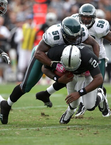 OAKLAND, CA - OCTOBER 18:  JaMarcus Russell #2 of the Oakland Raiders is sacked by Trent Cole #58 of the Philadelphia Eagles during an NFL game at the Oakland-Alameda County Coliseum on October 18, 2009 in Oakland, California.  <br /><br /><span class="help">(Photo by Jed Jacobsohn/Getty Images)</span>