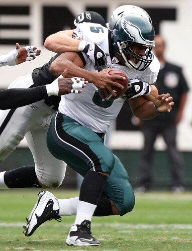 OAKLAND, CA - OCTOBER 18:   Donovan McNabb #5 of the Philadelphia Eagles is sacked by Trevor Soctt #91 of the Oakland Raiders during an NFL game at the Oakland-Alameda County Coliseum on October 18, 2009 in Oakland, California.  <br /><br /><span class="help">(Photo by Jed Jacobsohn/Getty Images)</span>