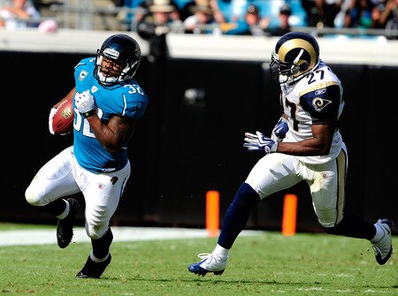 JACKSONVILLE, FL - OCTOBER 18: Maurice Jones Drew #32 of the Jacksonville Jaguars is chased by David Roach #27 of the St. Louis Rams during the game at the Jacksonville Municipal Stadium on October 18, 2009 in Jacksonville, Florida. <br /><br /><span class="help">(Photo by Sam Greenwood/Getty Images)</span>