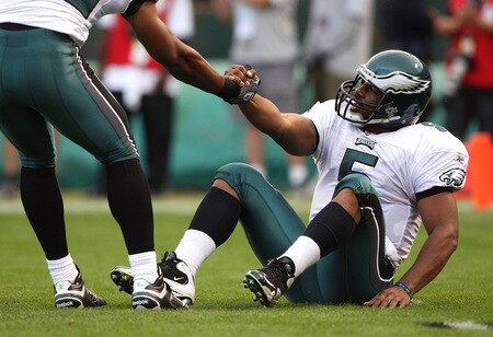 OAKLAND, CA - OCTOBER 18:  Donovan McNabb #5 of the Philadelphia Eagles is helped off of the ground against the Oakland Raiders during an NFL game at the Oakland-Alameda County Coliseum on October 18, 2009 in Oakland, California.  <br /><br /><span class="help">(Photo by Jed Jacobsohn/Getty Images)</span>