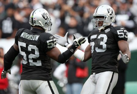 OAKLAND, CA - OCTOBER 18:  Thomas Howard #53 and Kirk Morrison #52 of the Oakland Raiders celebrate after a play against the Philadelphia Eagles during an NFL game at the Oakland-Alameda County Coliseum on October 18, 2009 in Oakland, California.  <br /><br /><span class="help">(Photo by Jed Jacobsohn/Getty Images)</span>