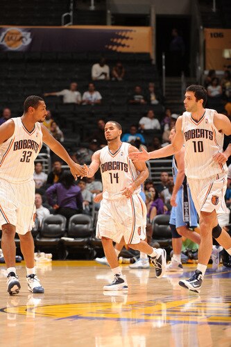 LOS ANGELES - OCTOBER 18:  Boris Diaw #32, D.J. Augustin #14, and Vladimir Radmanovic #10 of the Charlotte Bobcats slap hands during their game agaisnt the Utah Jazz at Staples Center on October 18, 2009 in Los Angeles, California. <br /><br /><span class="help">(Photo by Noah Graham/NBAE via Getty Images)</span>