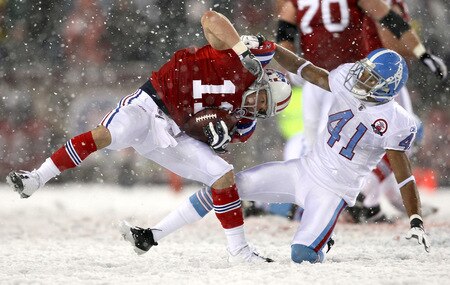FOXBORO - OCTOBER 18:  Julian Edelman #11 of the New England Patriots is grabbed by Cary Williams #41 of Tennesee Titans at Gillette Stadium on October 18, 2009 in Foxboro, Massachusetts. The Patriots won 59-0. <br /><br /><span class="help">(Photo by Jim Rogash/Getty Images)</span>