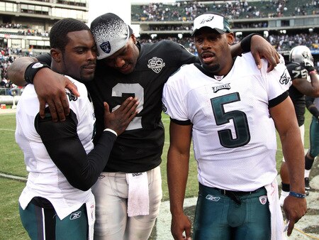 OAKLAND, CA - OCTOBER 18:  Donovan McNabb #5 of the Philadelphia Eagles talks with teammate Michael Vick #7 and JaMarcus Russell #2 of the Oakland Raiders at the end of an NFL game at the Oakland-Alameda County Coliseum on October 18, 2009 in Oakland, California.  <br /><br /><span class="help">(Photo by Jed Jacobsohn/Getty Images)</span>