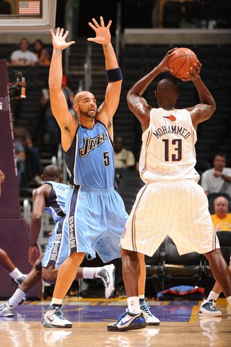 LOS ANGELES - OCTOBER 18:  Carlos Boozer #5 of the Utah Jazz defends against Nazr Mohammed #13 of the Charlotte Bobcats at Staples Center on October 18, 2009 in Los Angeles, California. <br /><br /><span class="help">(Photo by Noah Graham/NBAE via Getty Images)</span>