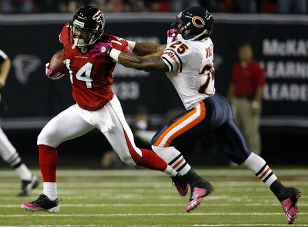 ATLANTA - OCTOBER 18:  Wide receiver Eric Weems #14 of the Atlanta Falcons is tackles by Garrett Wolfe #25 of the Chicago Bears after the opening kick off of the game at the Georgia Dome on October 18, 2009 in Atlanta, Georgia. <br /><br /><span class="help">(Photo by Kevin C. Cox/Getty Images)</span>