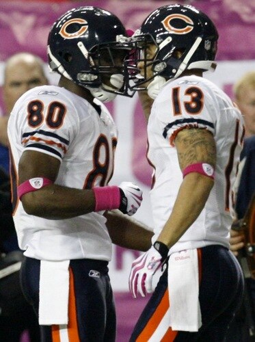 ATLANTA - OCTOBER 18:  Wide receiver Johnny Knox #13 of the Chicago Bears celebrates his 23 yard touchdown with teammate wide receiver 	Earl Bennett #80 of the Atlanta Falcons during the second quarter of the game at the Georgia Dome on October 18, 2009 in Atlanta, Georgia. <br /><br /><span class="help">(Photo by Kevin C. Cox/Getty Images)</span>