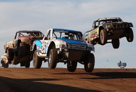 WITTMANN, AZ - OCTOBER 18:  LOORRS unlimited lite driver Heath Carpenter (C) leads Chris Brandt (L) and Brian Deegan (R) in the Lucas Oil Off Road Racing Series on October 18, 2009 at the Speedworld Off Road Park in Wittmann, Arizona  <br /><br /><span class="help">(Photo by Christian Petersen/Getty Images)</span>