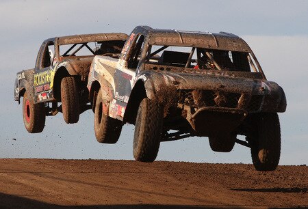 WITTMANN, AZ - OCTOBER 18:  LOORRS unlimited lite drivers Jimmy Stephensen (R) and Todd Cuffaro compete in the Lucas Oil Off Road Racing Series on October 18, 2009 at the Speedworld Off Road Park in Wittmann, Arizona  <br /><br /><span class="help">(Photo by Christian Petersen/Getty Images)</span>