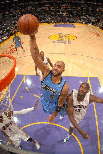 LOS ANGELES - OCTOBER 18:  Carlos Boozer #5 of the Utah Jazz rises for a dunk against Nazr Mohammed #13 of the Charlotte Bobcats at Staples Center on October 18, 2009 in Los Angeles, California. <br /><br /><span class="help">(Photo by Noah Graham/NBAE via Getty Images)</span>