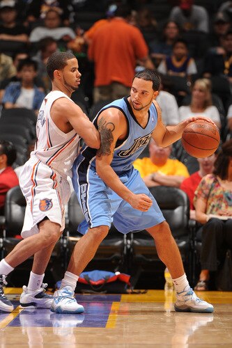LOS ANGELES - OCTOBER 18:  Deron Williams #8 of the Utah Jazz posts up against D.J. Augustin #14 of the Charlotte Bobcats at Staples Center on October 18, 2009 in Los Angeles, California. <br /><br /><span class="help">(Photo by Noah Graham/NBAE via Getty Images)</span>