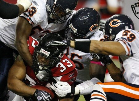ATLANTA - OCTOBER 18: Running back Michael Turner #33 of the Atlanta Falcons is tackled by the Chicago Bears defense in the third quarter of the game at the Georgia Dome on October 18, 2009 in Atlanta, Georgia. <br /><br /><span class="help">(Photo by Kevin C. Cox/Getty Images)</span>