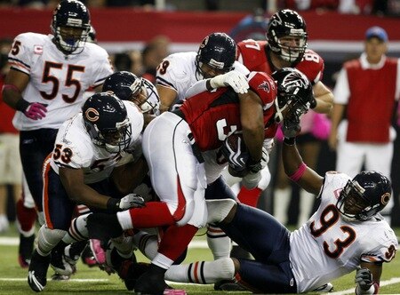 ATLANTA - OCTOBER 18:  Running back Michael Turner #33 of the Atlanta Falcons is tackled by the Chicago Bears defense in the game at the Georgia Dome on October 18, 2009 in Atlanta, Georgia. <br /><br /><span class="help">(Photo by Kevin C. Cox/Getty Images)</span>