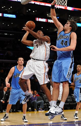 LOS ANGELES, CA - OCTOBER 18:  Derrick Brown #4 of the Charlotte Bobcats puts a shot up against Kyrylo Fesenko #44 of the Utah Jazz durng a preseason game at Staples Center on October 18, 2009 in Los Angeles, California.  <br /><br /><span class="help">(Photo by Lisa Blumenfeld/NBAE/Getty Images)</span>