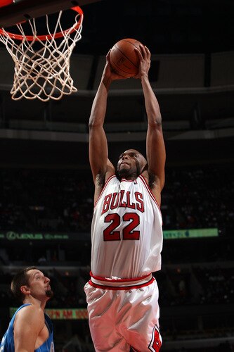 CHICAGO - OCTOBER 19: Taj Gibson #22 of the Chicago Bulls dunks against Ryan Anderson #33 of the Orlando Magic during a pre-season game on October 19, 2009 at the United Center in Chicago, Illinois.  <br /><br /><span class="help">(Photo by Gary Dineen/NBAE via Getty Images)</span>