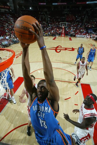HOUSTON - OCTOBER 19: James Harden #13 of the Oklahoma City Thunder shoots the ball over Pops Mensah-Bonsu #21 of the Houston Rockets on October 19, 2009 at the Toyota Center in Houston, Texas. <br /><br /><span class="help">(Photo by Bill Baptist/NBAE via Getty Images)</span>