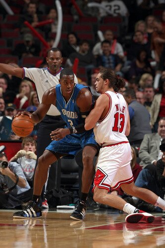 CHICAGO - OCTOBER 19: Dwight Howard #12 of the Orlando Magic posts up against Joakim Noah #13 of the Chicago Bulls during a pre-season game on October 19, 2009 at the United Center in Chicago, Illinois.  <br /><br /><span class="help">(Photo by Gary Dineen/NBAE via Getty Images)</span>
