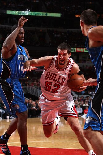 CHICAGO - OCTOBER 19: Brad Miller #52 of the Chicago Bulls drives to the basket against Dwight Howard #12 of the Orlando Magic during a pre-season game on October 19, 2009 at the United Center in Chicago, Illinois.  <br /><br /><span class="help">(Photo by Gary Dineen/NBAE via Getty Images)</span>