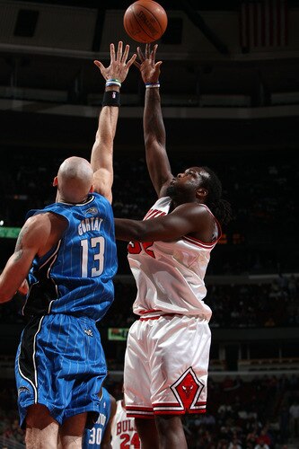 CHICAGO - OCTOBER 19: Chris Richard #32 of the Chicago Bulls shoots a hook shot against Marcin Gortat #13 of the Orlando Magic during a pre-season game on October 19, 2009 at the United Center in Chicago, Illinois.  <br /><br /><span class="help">(Photo by Gary Dineen/NBAE via Getty Images)</span>