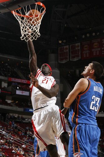 HOUSTON - OCTOBER 19: Pops Mensah-Bonsu #21 of the Houston Rockets shoots the ball over Byron Mullens #23 of the Oklahoma City Thunder on October 19, 2009 at the Toyota Center in Houston, Texas. <br /><br /><span class="help">(Photo by Bill Baptist/NBAE via Getty Images)</span>