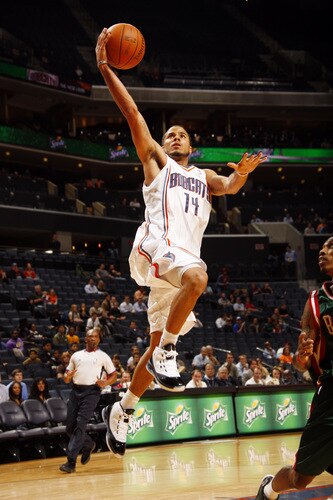 CHARLOTTE, NC - OCTOBER 20:   D.J. Augustin #14 of the Charlotte Bobcats shoots against the Milwaukee Bucks on October 20, 2009 at Time Warner Cable Arena in Charlotte, North Carolina.  <br /><br /><span class="help">(Photo by Kent Smith/NBAE via Getty Images)</span>