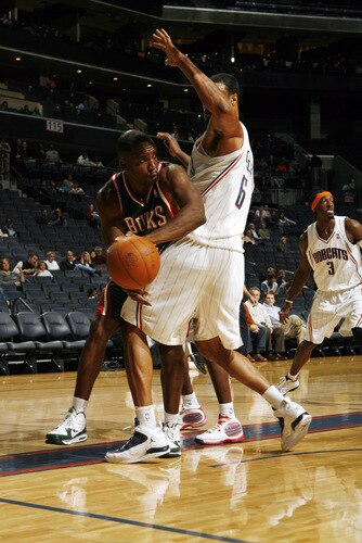 CHARLOTTE, NC - OCTOBER 20:  Tyson Chandler #6 of the Charlotte Bobcats guards against the Milwaukee Bucks on October 20, 2009 at Time Warner Cable Arena in Charlotte, North Carolina.  <br /><br /><span class="help">(Photo by Brock Williams-Smith/NBAE via Getty Images)</span>