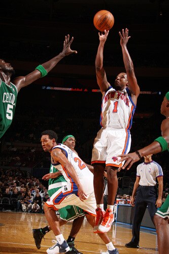 NEW YORK - OCTOBER 20: Chris Duhon #1 of the New York Knicks shoots against Kevin Garnett #5 of the Boston Celtics on October 20, 2009 at Madison Square Garden in New York City. <br /><br /><span class="help">(Photo by Nathaniel S. Butler/NBAE via Getty Images)</span>