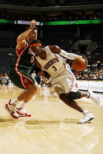 CHARLOTTE, NC - OCTOBER 20:  Gerald Wallace #3 of the Charlotte Bobcats drives to the basket against Carlos Delfino #10 of the Milwaukee Bucks on October 20, 2009 at Time Warner Cable Arena in Charlotte, North Carolina.  <br /><br /><span class="help">(Photo by Brock Williams-Smith/NBAE via Getty Images)</span>