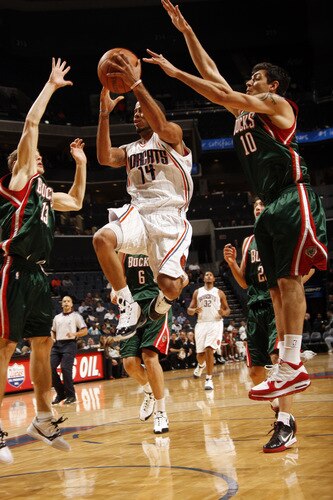 CHARLOTTE, NC - OCTOBER 20:  Carlos Delfino #10 of the Milwaukee Bucks blocks against D.J. Augustin #14 of the Charlotte Bobcats on October 20, 2009 at Time Warner Cable Arena in Charlotte, North Carolina.  <br /><br /><span class="help">(Photo by Kent Smith/NBAE via Getty Images)</span>