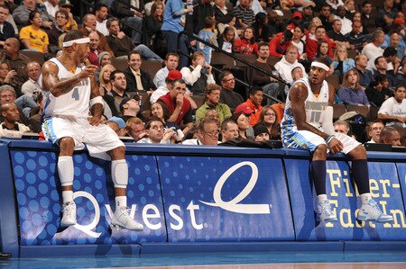 DENVER - OCTOBER 20: Kenyon Matin #4 and Carmelo Anthony #15 of the Denver Nuggets talk during a time out against the Minnesota Timberwolves on October 20, 2009 at the Pepsi Center in Denver, Colorado. <br /><br /><span class="help">(Photo by Garrett W. Ellwood/NBAE via Getty Images)</span>