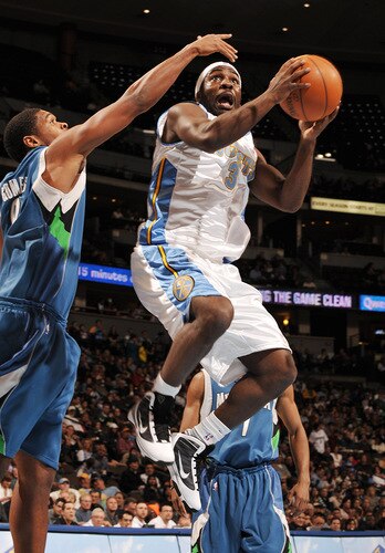 DENVER - OCTOBER 20: Ty Lawson #3 of the Denver Nuggets goes to the basket against Ryan Gomes #8 of the Minnesota Timberwolves on October 20, 2009 at the Pepsi Center in Denver, Colorado. <br /><br /><span class="help">(Photo by Garrett W. Ellwood/NBAE via Getty Images)</span>