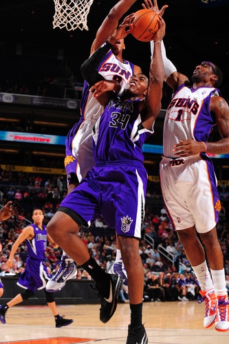 PHOENIX - OCTOBER 20: Channing Frye #8 and Amare Stoudemire #1 of the Phoenix Suns try to block the shot of Jason Thompson #34 of the Sacramento Kings in an NBA Game played on October 20, 2009 at U.S. Airways Center in Phoenix, Arizona. <br /><br /><span class="help">(Photo by P. A. Molumby/NBAE via Getty Images)</span>