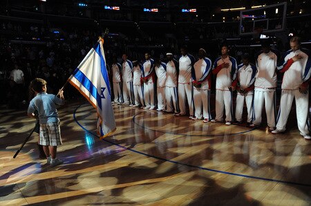 LOS ANGELES - OCTOBER 20:  The Los Angeles Clippers stand during the performance of the National Anthem before their game against Maccabi Electra Tel Aviv at Staples Center on October 20, 2009 in Los Angeles, California. <br /><br /><span class="help">(Photo by Andrew D. Bernstein/NBAE via Getty Images)</span>
