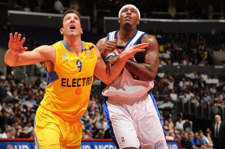 LOS ANGELES - OCTOBER 20:  Yaniv Green #9 of Maccabi Electra Tel Aviv and Craig Smith #5 of the Los Angeles Clippers box out during their game at Staples Center on October 20, 2009 in Los Angeles, California. <br /><br /><span class="help">(Photo by Andrew D. Bernstein/NBAE via Getty Images)</span>