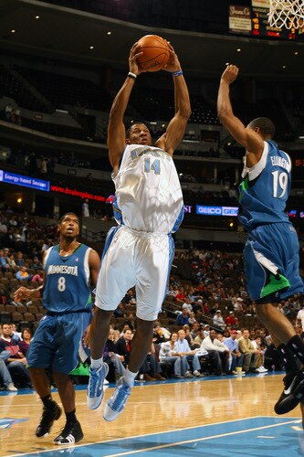 DENVER - OCTOBER 20: Joey Graham #14 of the Denver Nuggets goes to the basket against Wayne Ellington #19 of the Minnesota Timberwolves on October 20, 2009 at the Pepsi Center in Denver, Colorado. <br /><br /><span class="help">(Photo by Garrett W. Ellwood/NBAE via Getty Images)</span>