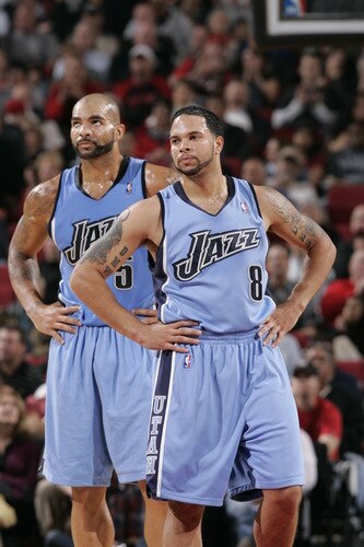 PORTLAND, OR - OCTOBER 20:  Deron Williams #8 and Carlos Boozer #5 of the Utah Jazz watch the ball during a preseason game against the Portland Trail Blazers on October 20, 2009 at the Rose Garden Arena in Portland, Oregon. <br /><br /><span class="help">(Photo by Sam Forencich/NBAE via Getty Images)</span>